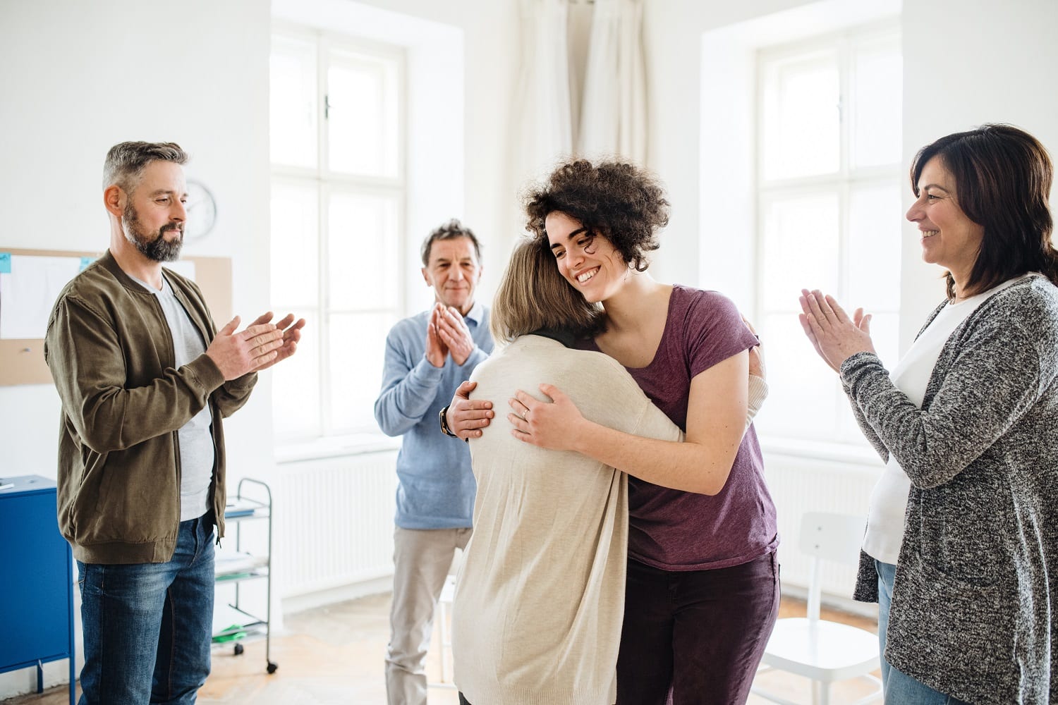 Group of men and women during group therapy