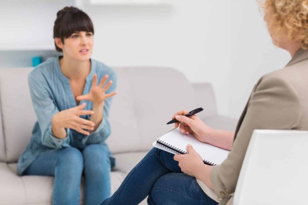 a person talks while a therapist listens