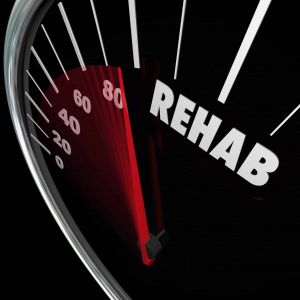 a speedometer that is approaching "rehab"