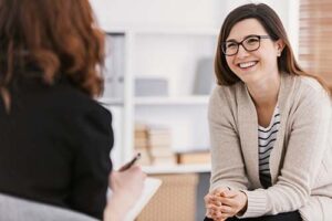 Woman talks to client about client reviews
