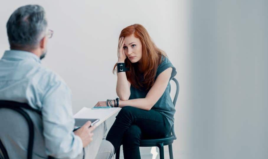 a person looks anxiously at their therapist