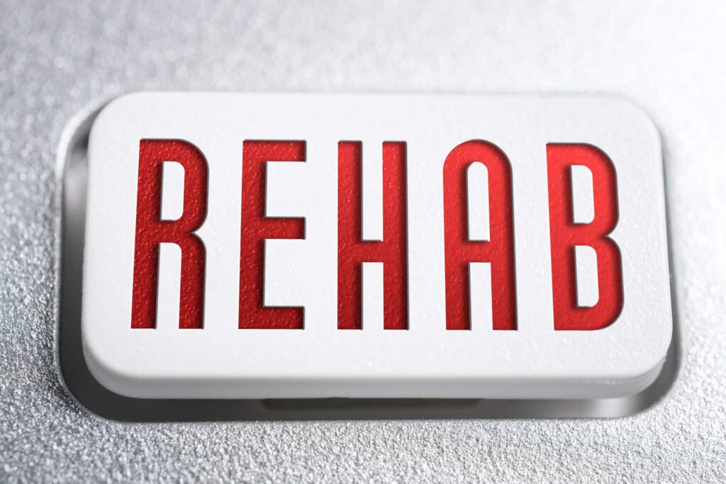a sign that reads "rehab"