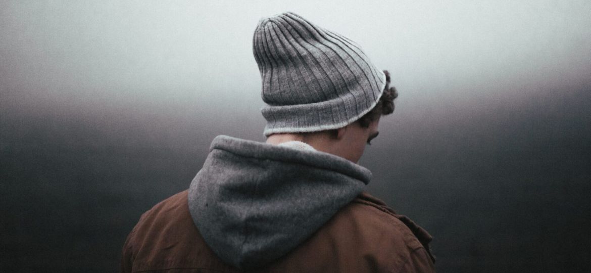 a person walks into fog
