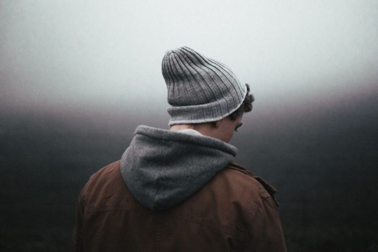 a person walks into fog