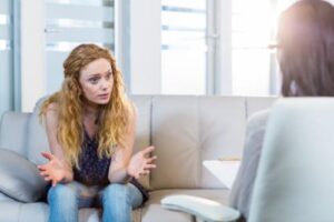 a person talks to a therapist in an ohio drug rehab center for addiction treatment
