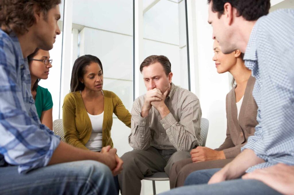 a group supports a person in therapy