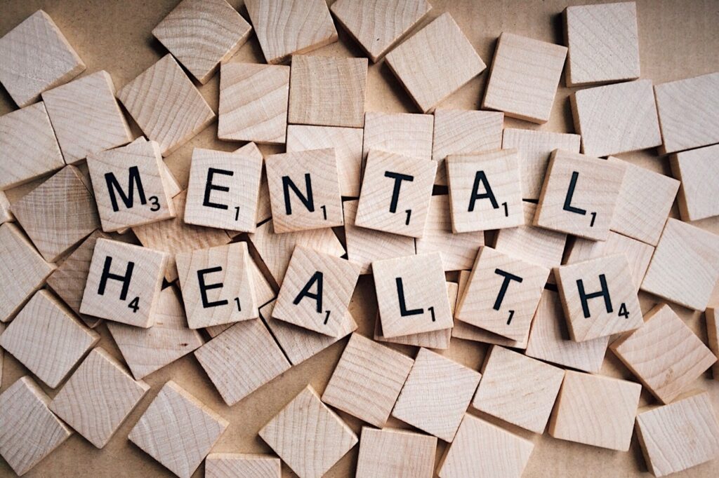 scrabble tiles that spell out "Mental health"
