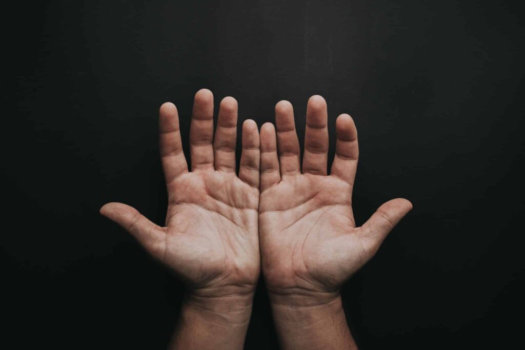 two hands outstretched waiting to receive something