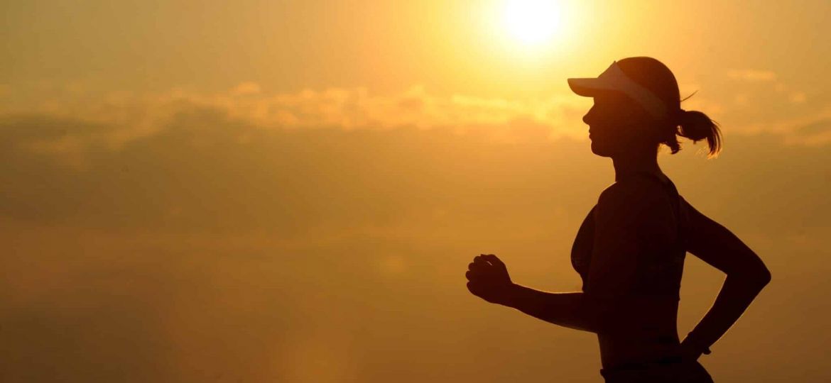 a person jogs at sunset