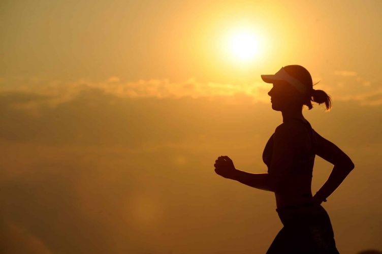 a person jogs at sunset