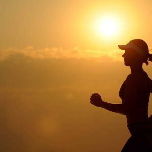 a person jogs at sunset