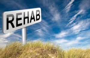 a sign reading "rehab'