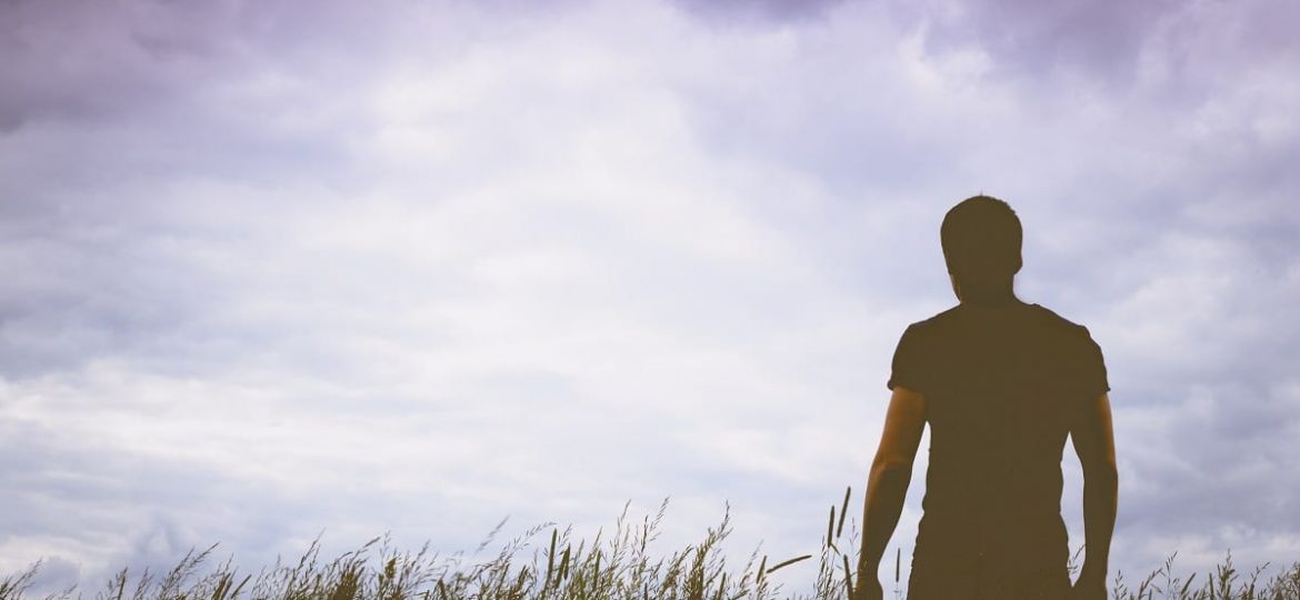 a person walks through a field