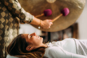 A patient in a sound bath therapy program