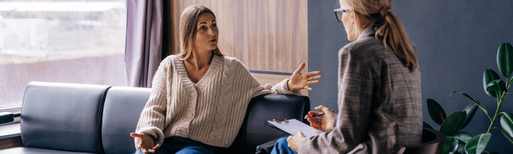 Woman gesturing and talking to her therapist