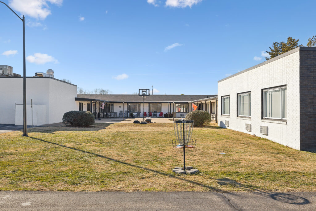 Photograph of the courtyard at apex recovery, where clients can play games