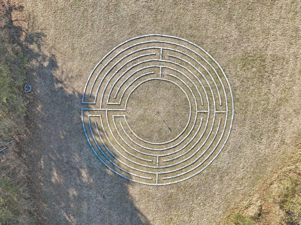 An ariel drone shot of the labyrinth on the grounds of apex recovery