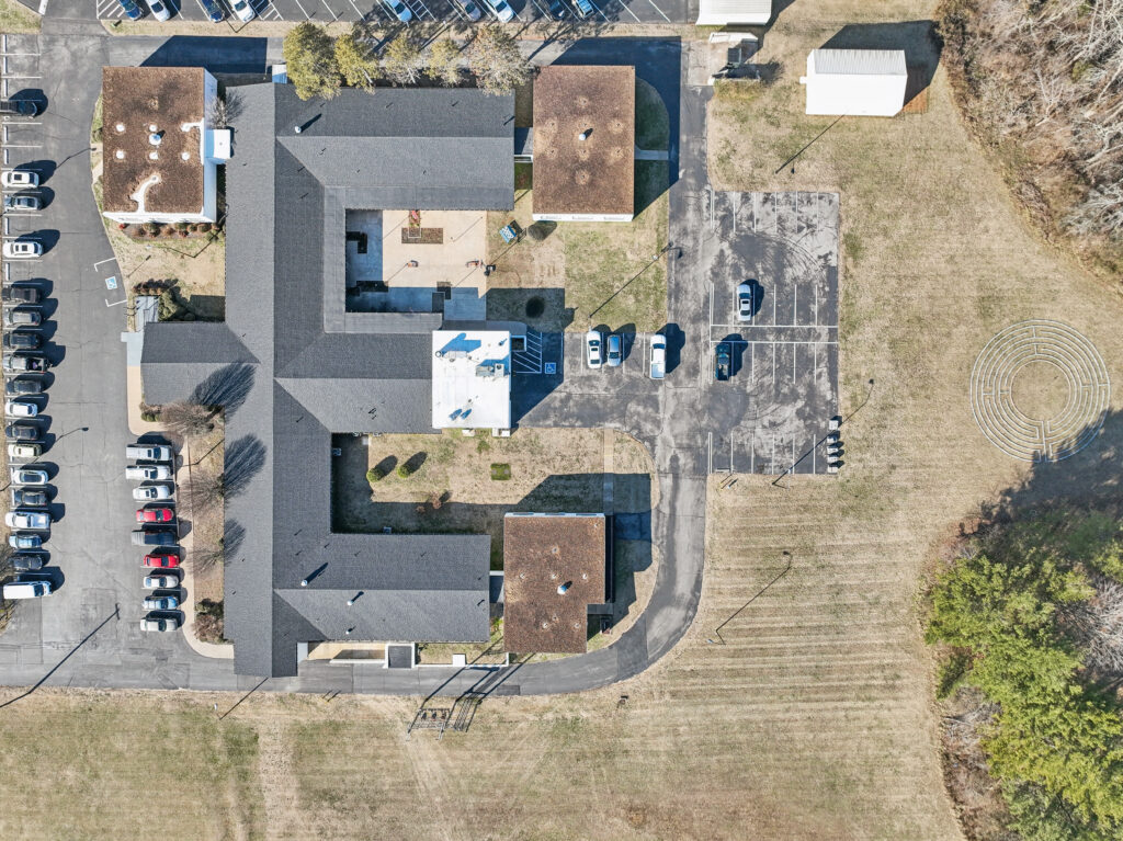 Ariel drone photograph of the grounds of apex recovery, showing the main building as well as the labyrinth at the back