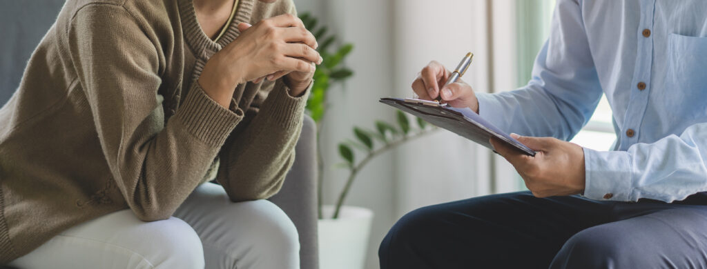 mental health treatment concept. Stressed patient talking with personal psychologist in therapist session