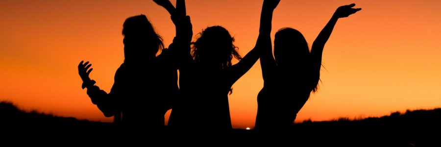 Silhouette of women celebrating recovery.